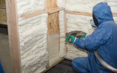 contractor applying spray foam insulation